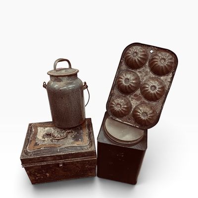 Collection of antique metal kitchenware and containers, including a small milk can, a decorative tin box, a tall canister, and a vintage...
