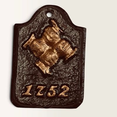 Vintage cast iron fire insurance mark plaque featuring a raised four-hand clasp design and the date 1752, painted in black and gold.
