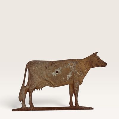 Antique cast iron cow weather vane topper featuring an aged, rusted finish and natural patina.