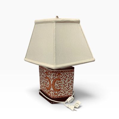Sale Photo Thumbnail #32: Asian-style ceramic tea caddy table lamp featuring intricate red scrollwork on a white ground, paired with a cream square pagoda shade.