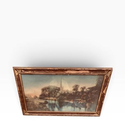 Sale Photo Thumbnail #35: Antique framed landscape print featuring a river, trees, and a church steeple in the distance, housed in a distressed wooden frame with carved details.