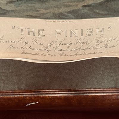 Sale Photo Thumbnail #14: Close-up detail of a framed antique lithograph titled "The Finish," published by L. Prang & Co. Boston, depicting the 1885 America's Cup Race.