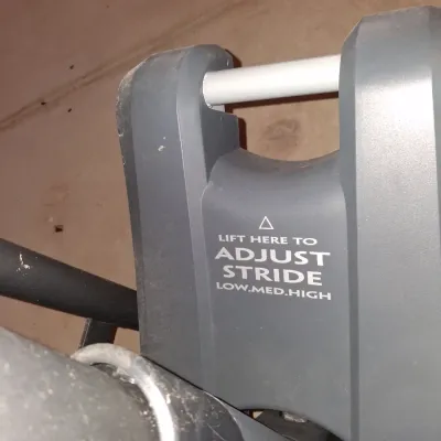 Sale Photo Thumbnail #649: THIS IS LOCATED IN THE BASEMENT 
GOLD'S GYM STRIDE TRAINER ELLIPTICAL MACHINE. FEATURES ADJUSTABLE STRIDE, DIGITAL DISPLAY CONSOLE WITH WORKOUT PROGRAMS, BUILT-IN FAN, RESISTANCE CONTROLS, AND HEART RATE GRIPS. LIGHT SURFACE DUST AND PREVIOUS USE WEAR VIS