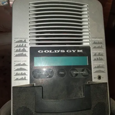 Sale Photo Thumbnail #654: THIS IS LOCATED IN THE BASEMENT 
GOLD'S GYM STRIDE TRAINER ELLIPTICAL MACHINE. FEATURES ADJUSTABLE STRIDE, DIGITAL DISPLAY CONSOLE WITH WORKOUT PROGRAMS, BUILT-IN FAN, RESISTANCE CONTROLS, AND HEART RATE GRIPS. LIGHT SURFACE DUST AND PREVIOUS USE WEAR VIS