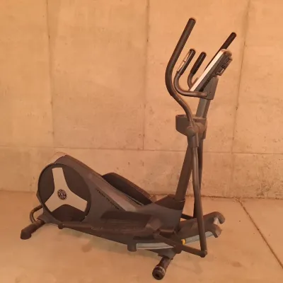 Sale Photo Thumbnail #646: THIS IS LOCATED IN THE BASEMENT 
GOLD'S GYM STRIDE TRAINER ELLIPTICAL MACHINE. FEATURES ADJUSTABLE STRIDE, DIGITAL DISPLAY CONSOLE WITH WORKOUT PROGRAMS, BUILT-IN FAN, RESISTANCE CONTROLS, AND HEART RATE GRIPS. LIGHT SURFACE DUST AND PREVIOUS USE WEAR VIS