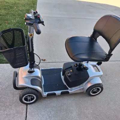 Sale Photo Thumbnail #4: Features:  

EASY MANEUVERABILITY: Four flat-free tires on a stable base let this 4 wheel scooter move across carpet, tile, sidewalks and gentle slopes with good control

VARIABLE SPEED CONTROL: Speed dial on this electric 4 wheel scooter for adults adjus