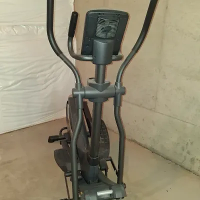 Sale Photo Thumbnail #653: THIS IS LOCATED IN THE BASEMENT 
GOLD'S GYM STRIDE TRAINER ELLIPTICAL MACHINE. FEATURES ADJUSTABLE STRIDE, DIGITAL DISPLAY CONSOLE WITH WORKOUT PROGRAMS, BUILT-IN FAN, RESISTANCE CONTROLS, AND HEART RATE GRIPS. LIGHT SURFACE DUST AND PREVIOUS USE WEAR VIS