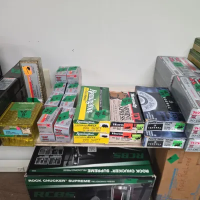 Sale Photo Thumbnail #94: Assortment of boxed rifle ammunition, including Remington .220 Swift and Federal Power-Shok .30-06, along with an RCBS Rock Chucker Supreme reloading press in its original box.