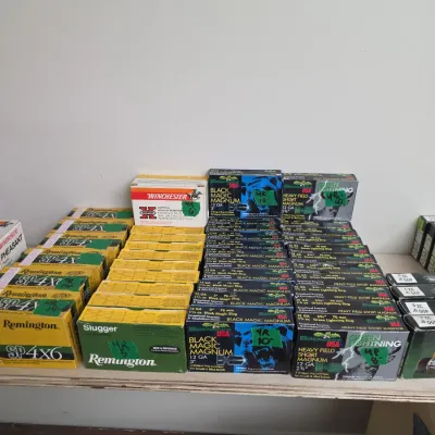 Sale Photo Thumbnail #101: Large assortment of vintage and modern shotgun ammunition boxes, including Remington SP4x6, Remington Slugger, Winchester Super-X, and Brenneke USA Black Magic Magnum 12 gauge shells.