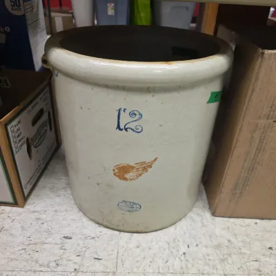 Sale Photo Thumbnail #44: Vintage Red Wing Stoneware 12-gallon crock featuring the classic red wing decal and blue oval stamp.