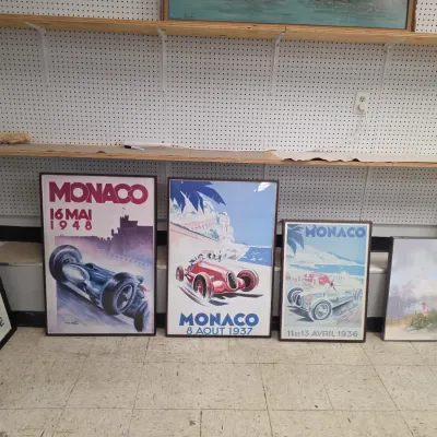 Sale Photo Thumbnail #22: Collection of framed vintage Monaco Grand Prix race art prints, including designs dated 1948, 1937, and 1936.