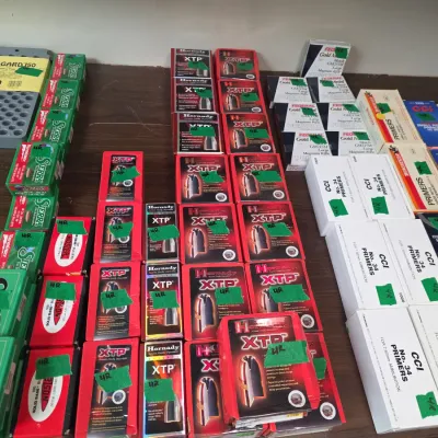 Sale Photo Thumbnail #88: Collection of reloading supplies including boxed bullets from Hornady, Sierra, and Nosler, along with CCI and Federal primers.