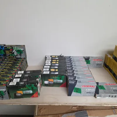Sale Photo Thumbnail #100: Collection of assorted vintage and modern boxed ammunition, including Federal Classic shotgun shells and Rottweil Brenneke 12-gauge slugs.