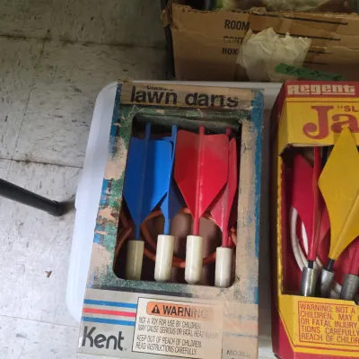 Sale Photo Thumbnail #50: Vintage Kent lawn darts game set in its original box, alongside another Regent brand lawn darts set.
