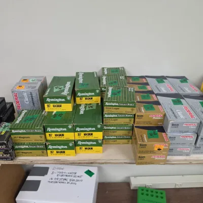 Sale Photo Thumbnail #96: Assortment of boxed ammunition, including Remington and Federal brands in .357 Magnum and 9mm Luger, alongside reloading equipment boxes.