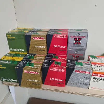 Sale Photo Thumbnail #102: Collection of vintage 12-gauge shotgun ammunition boxes by Federal, Remington, and Winchester.