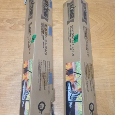 Sale Photo Thumbnail #63: Two Lodge 60-40 inch adjustable camp tripods, boxed in original retail packaging.