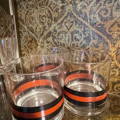 Sale Photo Thumbnail #863: Mid-Century Modern Lowball Glasses with Orange and Black Bands
