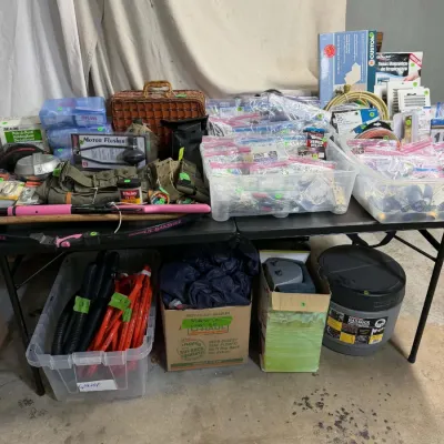 Sale Photo Thumbnail #34: Assortment of garage and household items, bins filled with hardware, a portable Hassock toilet, a motor flusher, and various tools.