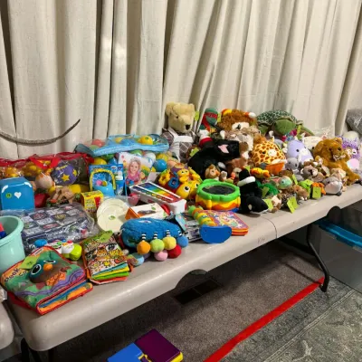 Sale Photo Thumbnail #16: Large collection of children's plush animals, soft books, and educational activity toys.