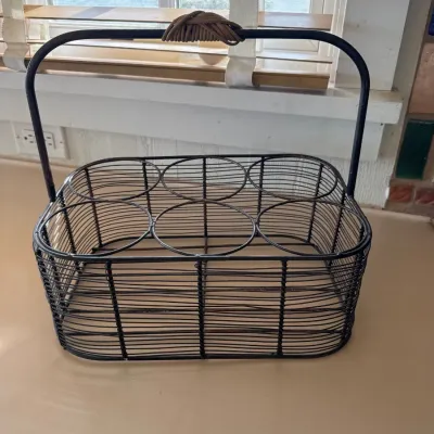 Sale Photo Thumbnail #44: Vintage dark metal wire caddy designed to hold six bottles or glasses, featuring a top carrying handle wrapped in cord.