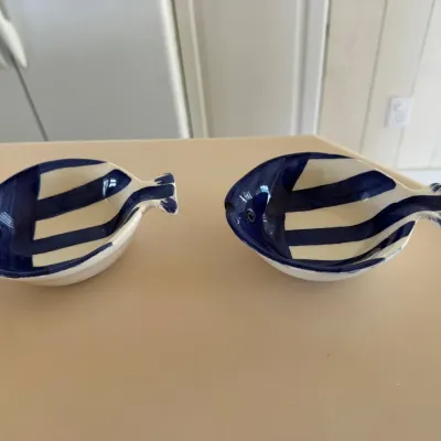 Sale Photo Thumbnail #36: Pair of small ceramic fish-shaped trinket dishes featuring hand-painted navy blue and white nautical stripes.