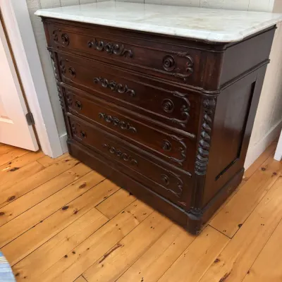 Sale Photo Thumbnail #26: Antique marble-top dark wood dresser with ornate carved floral drawer fronts and spiral column details.