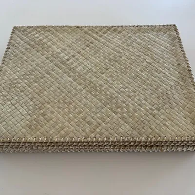 Sale Photo Thumbnail #41: Stack of woven rectangular placemats with stitched whipstitched borders, appearing in good condition.