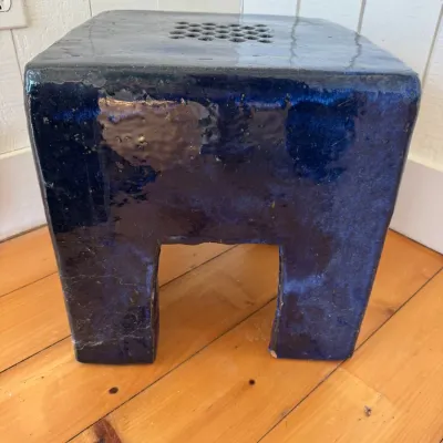 Sale Photo Thumbnail #25: Cobalt blue glazed ceramic garden stool featuring a square arch form with a grid pattern cut out on the top surface.