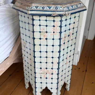 Sale Photo Thumbnail #50: Hand-painted Moroccan-style hexagonal pedestal table featuring distressed blue and cream geometric detailing.