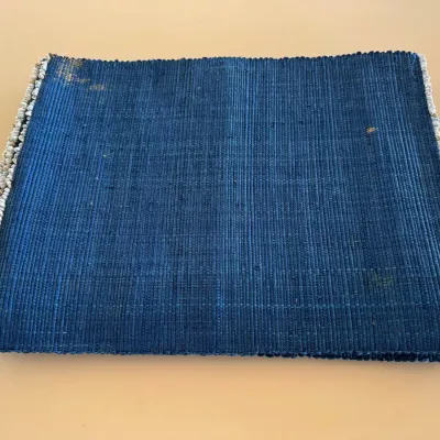 Sale Photo Thumbnail #43: Vintage indigo dyed woven placemat or mat featuring small shell trim along the side edges.