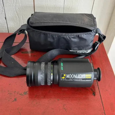Sale Photo Thumbnail #16: Vintage Moonlight NV-100 night vision monocular with a fitted black Zenit carrying case and shoulder strap.