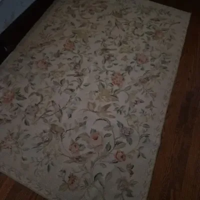 Sale Photo Thumbnail #41: Vintage rectangular area rug featuring a muted cream field with an ornate floral and botanical vine pattern in soft pastel hues.