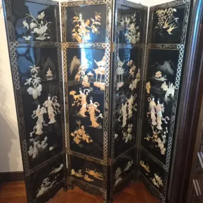 Sale Photo Thumbnail #8: Four-panel vintage Chinese black lacquer folding screen featuring intricate mother-of-pearl and soapstone inlay depicting figures, flora, and architectural elements.