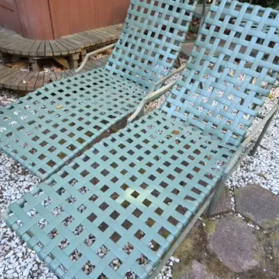 Sale Photo Thumbnail #171: Pair of vintage sage green vinyl strap patio lounge chairs featuring metal frames and adjustable backs.