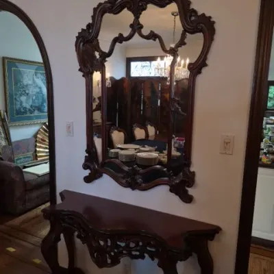 Sale Photo Thumbnail #11: Ornate Rococo Revival style carved wood console table and matching wall mirror set.