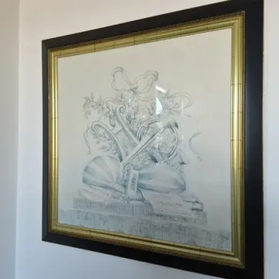Sale Photo Thumbnail #63: Large framed wall art print featuring classical musical instruments, lutes, a lyre, and ribbons, housed in a black and gold decorative frame.