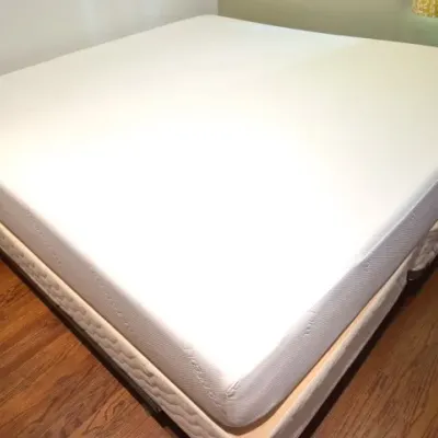 Sale Photo Thumbnail #112: Tuft & Needle memory foam mattress atop a split box spring and metal frame, clean condition.