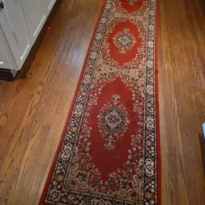 Sale Photo Thumbnail #42: Traditional Persian-style runner rug with red ground, ornate central medallions, and intricate geometric borders.