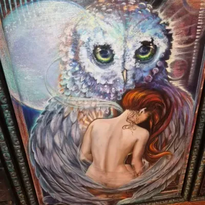Sale Photo Thumbnail #75: Framed fantasy art print on canvas depicting a large owl embracing a woman with red hair, set against a celestial background.
