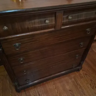 Sale Photo Thumbnail #109: Antique mahogany tallboy chest of drawers featuring fluted corner columns, brass hardware, and two small top drawers over four wide drawers.