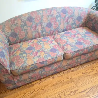 Sale Photo Thumbnail #28: Vintage arched-back sofa with muted floral tapestry upholstery and removable seat cushions.
