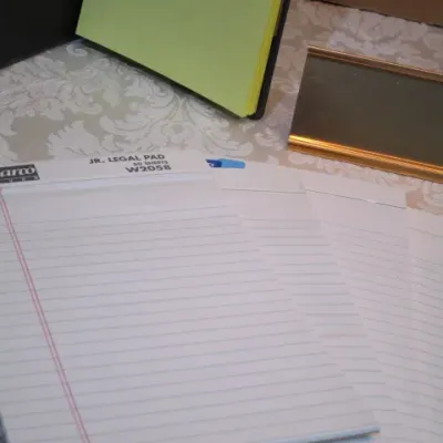 Sale Photo Thumbnail #301: Vintage Tiffen 37 mm Hayes-1 camera lens filter, 30 letter-size envelopes, 5 legal pads 5" x 7" (one with pad holder), 100+ index cards, 2 notepads, 1 pr. wireless headphones (uses C adapter not included), nameplate holder, see pictures