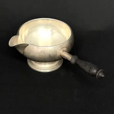 Vintage sterling silver  sauce or brandy warmer with a side pour spout and turned dark wood handle.