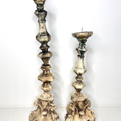 Pair of vintage baroque-style altar candle holders with distressed cream finish and prickets.