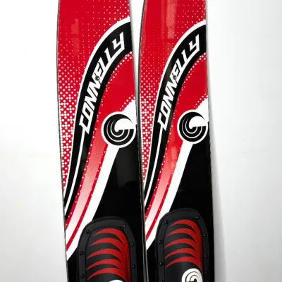 Pair of Connelly Voyage waterskis in red, black, and white with attached bindings and original promotional stickers intact.
