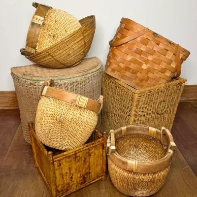 Collection of assorted vintage woven baskets and hampers, including split-wood, bamboo, and wicker styles.