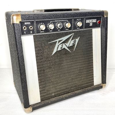 Vintage Peavey Backstage 30 solid-state guitar amplifier, featuring silver-capped control knobs and a textured black Tolex cabinet.