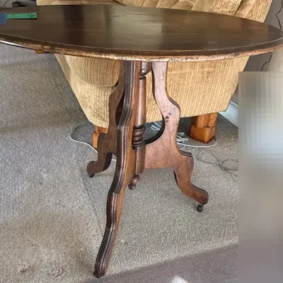 Wood Oval Side Table with Wheels, 34” x 24 1/2” x 29 1/2”