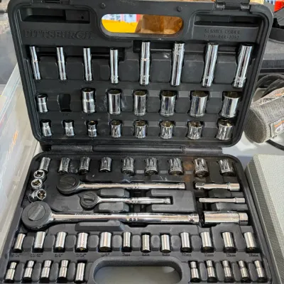 Sale Photo Thumbnail #28: Pittsburgh brand mechanic's tool set including ratchets and various sockets, housed in a molded black plastic carrying case.